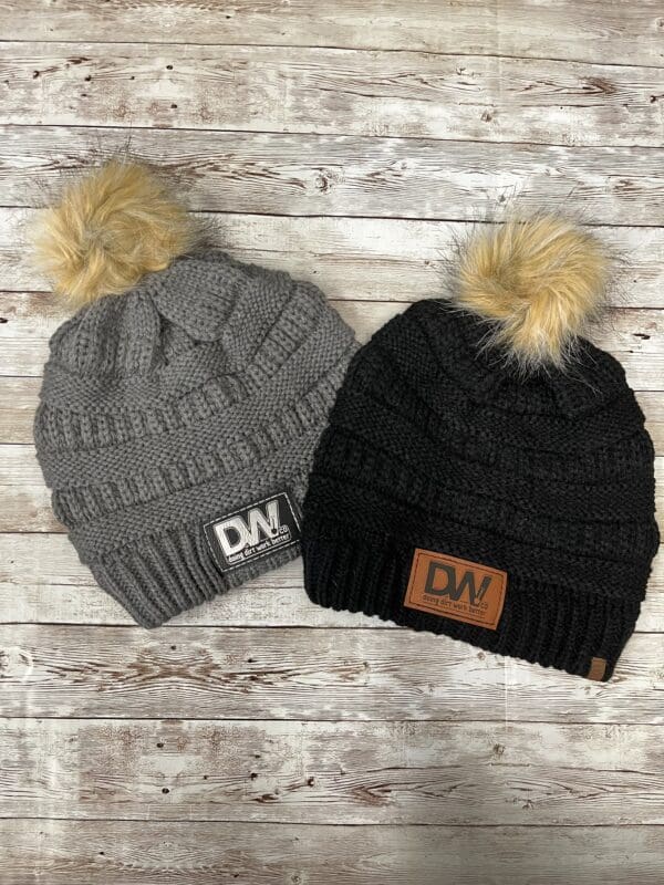Black and grey colored DW Faux Fur Pom Beanie caps