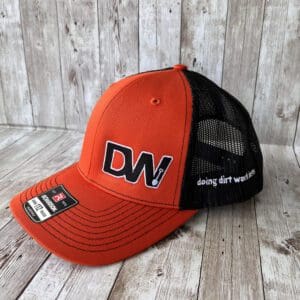 A DW Signature orange black snap back hat with logo
