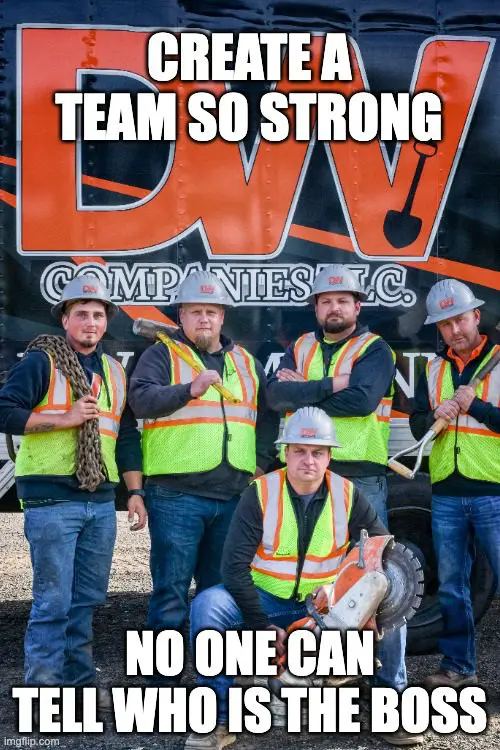 A group of construction workers posing for the camera.