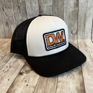 A black and white hat with an orange patch.