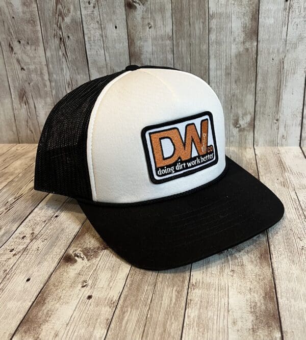 A black and white hat with an orange patch.
