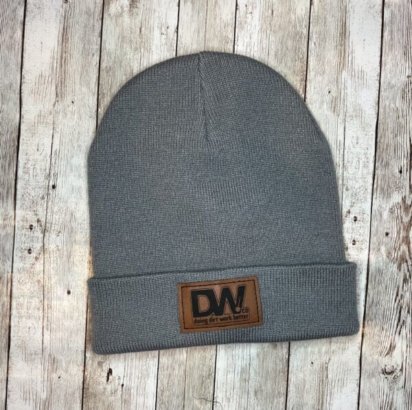 A gray beanie with the dw logo on it.