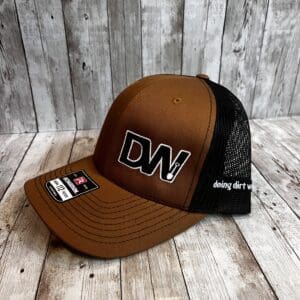 A brown and black hat with the letters dw on it.